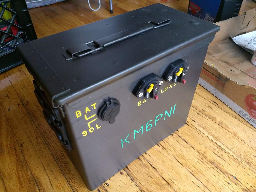 Ammo can battery box with ports and circuit breakers visible
