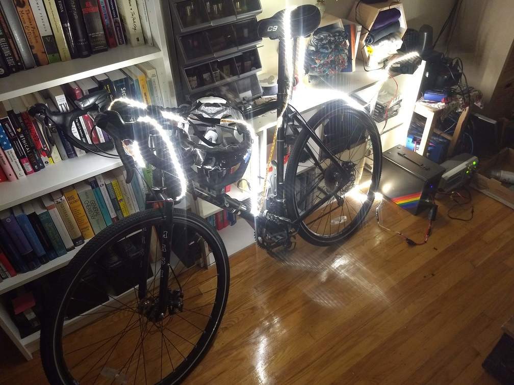 LED lights strung over a bicycle, powered from the battery box