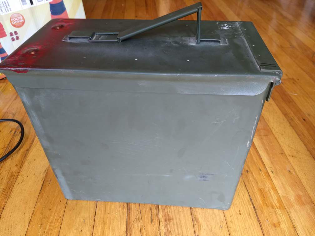 Bare ammo can painted a drab green