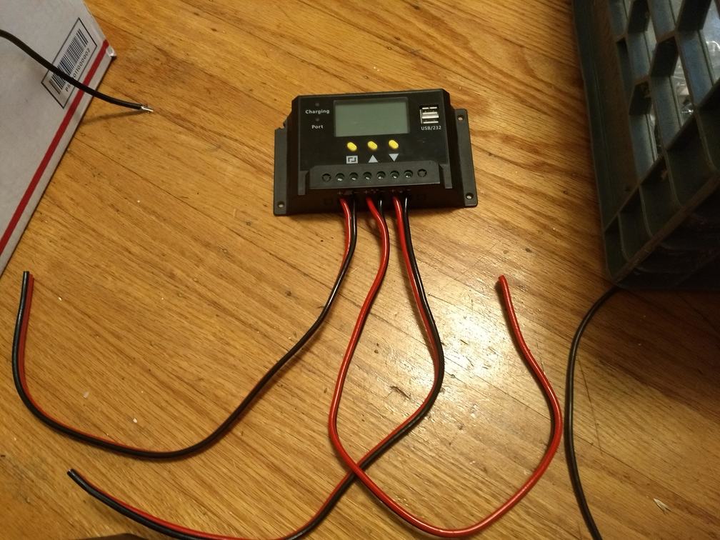 Solar charge controller with three pairs of wires coming out